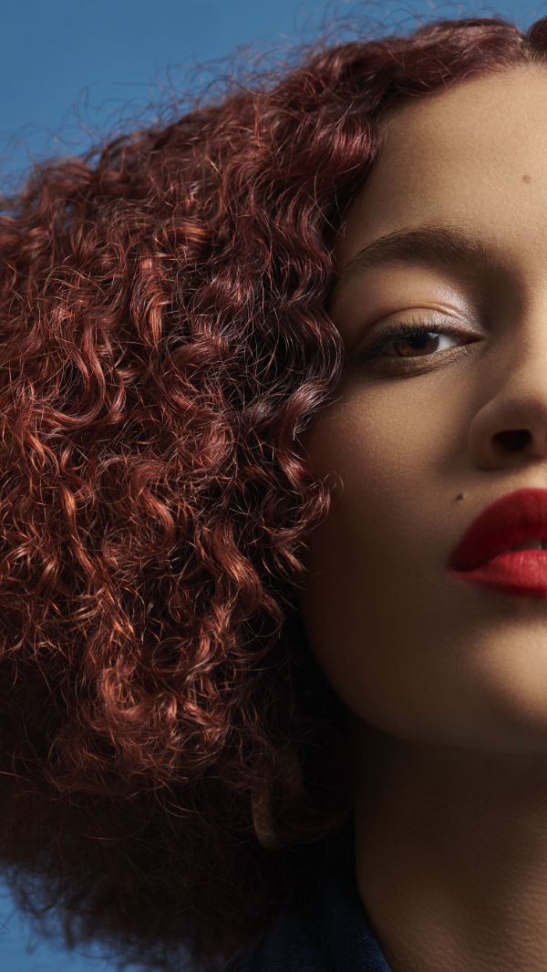Lady With Red Curly Hairs